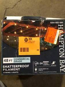 lot 48 image: Hampton Bay 24-Light 48 ft. Plug-in IndoorOutdoor Edison Patio String Light with S14 Single Filament LED Bulbs customer return see pictures