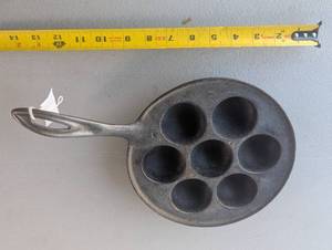 lot 25 image: Vintage Wagner Ware 1312 Aebleskiver Cast Iron Danish Cake Pan Dessert