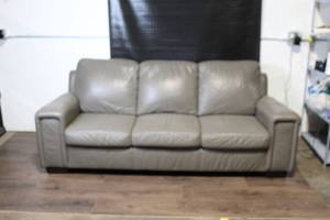 lot 11 image: Gray Leather Three-Seat Sofa