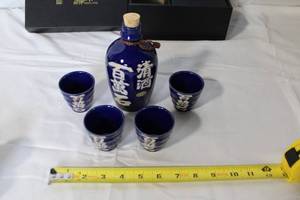 lot 36 image: Japanese Blue Sake Bottle with 4 Cups and Additional 5 Assorted Sake Cups