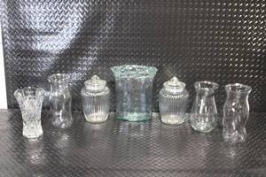 lot 40 image: Collection of 7 Assorted Clear Glass Vases and Jars with Lids