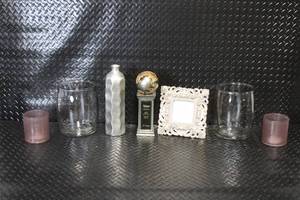 lot 42 image: Decorative Home Decor Lot with Glass Vases, Metal Bottle, Candle Holders, Frame, and Trophy