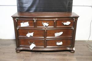 lot 83 image: Wooden 7-Drawer Dresser with Decorative Accents