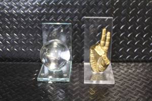 lot 176 image: Pair of Decorative Glass Bookends with Crystal Sphere and Gold Hand Design