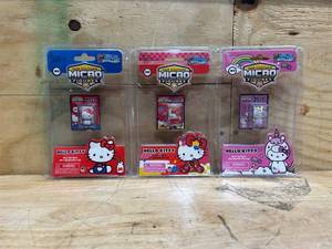 lot 24 image: Worlds Smallest Micro Figures Hello Kitty (lot of 3)