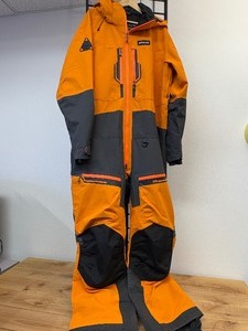 lot 15 image: Never Worn TOBE Tiro V3 Snowmobile Non-Insolated Monosuit in Orange & Grey European Size 3XL (US XL)