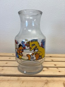 lot 51 image: Vintage Seaseme Street Glass Juice Jar