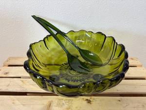 lot 21 image: 11 Vintage Indiana Glass avocado green footed serving bowl in the Sunflower  pattern, paired with  Lucite Matching Serving Utensils