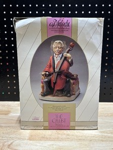 lot 33 image: Melody in Motion - The Cellist