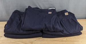 lot 542 image: 5 Carhartt Fire Resistant Work Pants in Blue, Size 48x34 Z