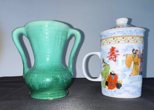 lot 39 image: Lot of 2 Asian Style Ceramic Pieces - Green Handled Vase and Lidded Infuser Mug