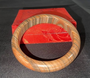 lot 41 image: Polished Stone Bangle Bracelet with Natural Striped Pattern