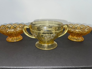 lot 63 image: Amber Glass Depression Era Sugar Bowl and 2 Matching Compote Dishes