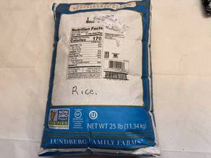 lot 42 image: Bag of Long Grain Brown Rice-bags has been taped so not full 25lbs but close