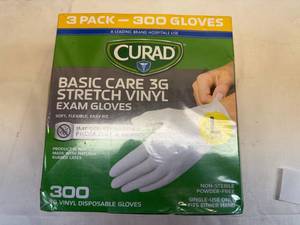 lot 52 image: Curad Size L Basic Care 3G Stretch Vinyl