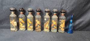 lot 34 image: Set of 7 Vintage Cabin Still and Old Fitzgerald Wildlife Bourbon Decanters with 1 Blue Decorative Glass Bottle