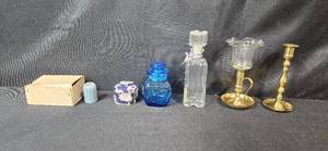 lot 46 image: Collection of Vintage Glass Bottles, Brass Candlestick Holders, and Decorative Containers