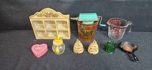 lot 128 image: Vintage Kitchenware Collection including Wall Organizer, Ice Cream Freezer, Pyrex Measuring Cup, and Decor