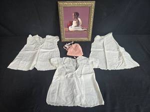 lot 156 image: Collection of Antique Baby Gowns, Knit Bonnet, and Framed Child Portrait Art