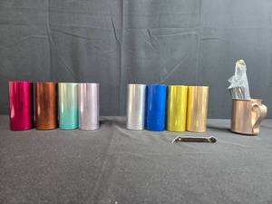 lot 201 image: Barware Set with Colored Metal Tumblers, Vintage Beer Bottle Opener, and Copper Mug