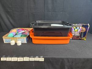 lot 321 image: Holiday Decor Lot Halloween Yard Stakes, Easter Eggs, Plastic Totes, and More