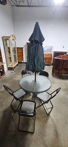 lot 357 image: Glass Patio Table with 4 Folding Chairs and Umbrella