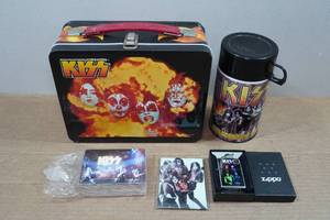 lot 106 image: Kiss Collectibles - Lighter, Lunch Box, Cards