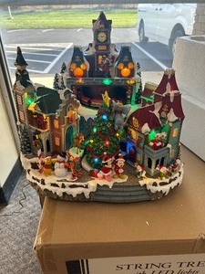 lot 18 image: Disney Animated Christmas Village with Lights and Music - MSRP $260