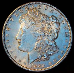 lot 84 image: AU 1889 P Morgan Silver, Original Surfaces wnear Full Luster