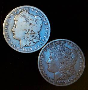 lot 97 image: (2) Circulated Silver Morgan Dollars (actual coins pictured)