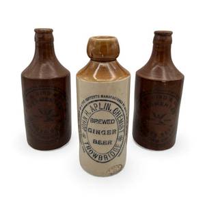 lot 13 image: Antique Ginger Beer Stoneware Bottles - 6 34 John H. Alpin Chemist Brewed & 7 R.M. Bird & Co. (Stratford on Avon)
