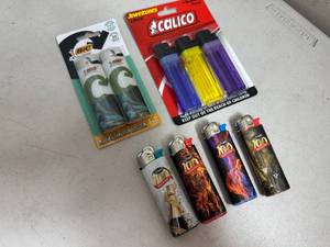 lot 143 image: 9 New Lighters