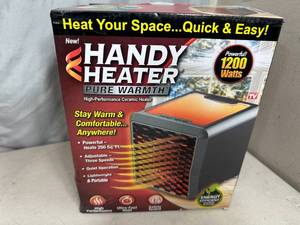 lot 197 image: New Handy Heater Pure Warmth Ceramic Space Heater with LED Lights