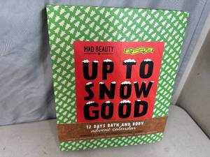 lot 64 image: New Mad Beauty 12 Day Bath and Body Advent Calendar