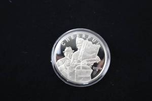 lot A-19 image: Boy Scouts Norman Rockwell Cheerful Sterling Silver Coin
