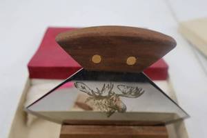 lot 39 image: Alaska Ulu Knife with Engraved Moose and Wood Stand
