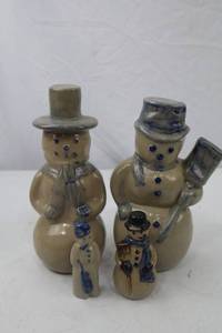 lot 48 image: 4-Piece Stoneware Snowman Christmas Figurine Lot