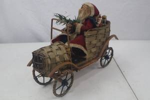 lot 55 image: Santa Claus Holiday Decor in Woven Basket Car