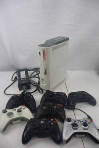 lot 63 image: Xbox 360 Console with 60GB HDD, Power Supply, and 7 Controllers