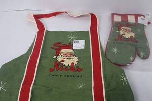 lot 140 image: Department 56 Saint Nicks Camp Ground Apron & Oven Mitt Set