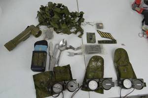 lot 218 image: US Army Vietnam War Era Field Gear Lot Compasses, Patches, Utensils, Flashlight