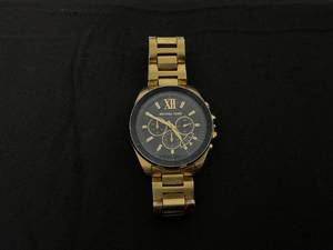 lot 17J image: Michael Kors Oversized Brecken Gold-Tone Watch (USED, Needs A Deep Clean And Repairs. Missing A Knob. Maybe Needs Battery)