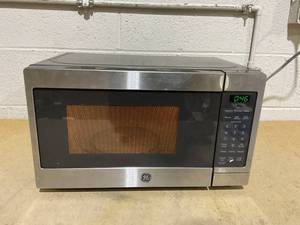 lot 362 image: GE Compact Countertop Microwave Oven, 0.7 Cubic Ft., 700-watt Capacity, 6 Auto Cooking Settings