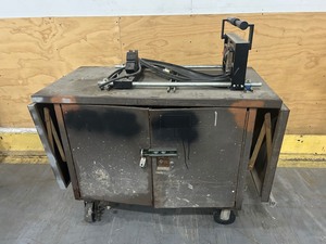 lot 18 image: Metal Work Bench with What Appears to be Tools for strut and conduit products