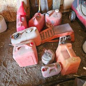 lot 58 image: Gas Can Lot with a pair of Car Ramps
