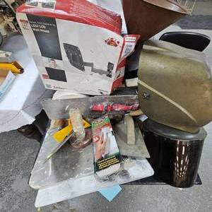 lot 11 image: Lot of 2 Welding Masks, Taper, and Cement Tools and TV Mount