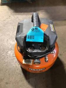 lot 18 image: RIDGID 6 Gal. 150 PSI Portable Electric Oil-Free Jobsite Pancake Air Compressor with Dual Pressure Gauges and 2-Quick Couplers customer return see pictures