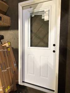 lot 31 image: JELD-WEN 36 in. x 80 in. 12 Lite Primed Steel Prehung Left-Hand Inswing Entry Door wBrickmould customer return see pictures