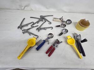 lot 41 image: Collection of Assorted Kitchen Tools Including Can Openers, Lemon Squeezers, and Measuring Cups