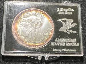 lot 25 image: 1989 AMERICAN SILVER EAGLE 1 TROY OZ .999 FINE SILVER NICELY TONED IN CASE